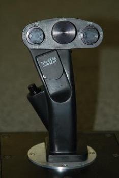 Close-up of a joystickAI-generated content may be incorrect.